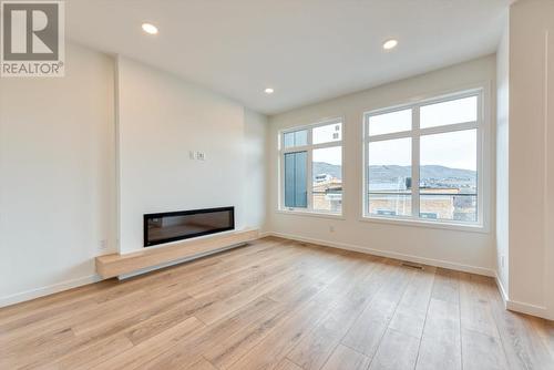 7599 Klinger Road Unit# 2, Vernon, BC - Indoor Photo Showing Living Room With Fireplace