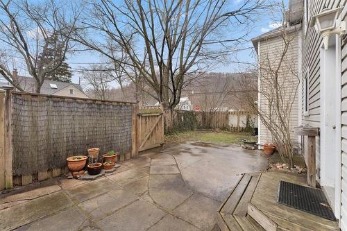 Side garden with patio. Access gate to driveway - 314 Park Street W, Dundas, ON - Outdoor