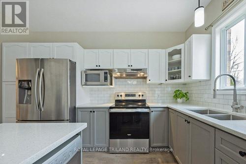 98 Meredith Dr N, Middlesex Centre, ON - Indoor Photo Showing Kitchen With Double Sink With Upgraded Kitchen