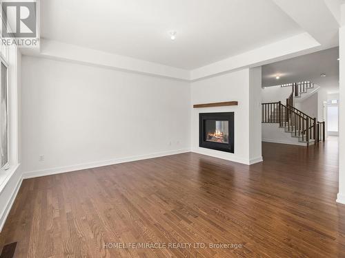 445 Turmeric Crt, Ottawa, ON - Indoor Photo Showing Living Room With Fireplace
