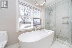 Renovated Primary En-Suite with Quartz Counters, Soaker Tub and Glass Shower - 