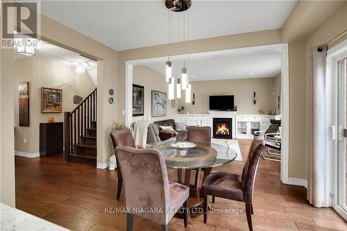 4512 Cinnamon Grove, Niagara Falls, ON - Indoor Photo Showing Dining Room With Fireplace