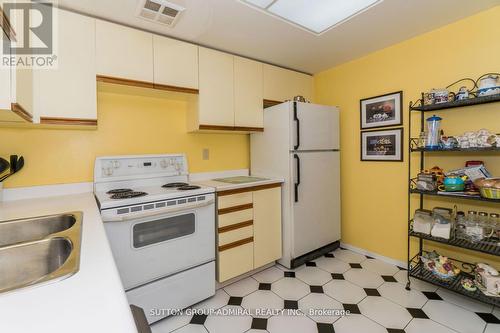 702 - 7601 Bathurst Street, Vaughan, ON - Indoor Photo Showing Kitchen With Double Sink