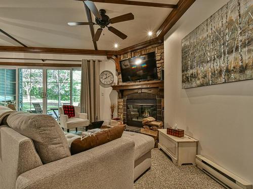 Living room - 7-102 Ch. Des Quatre-Sommets, Mont-Tremblant, QC - Indoor Photo Showing Living Room With Fireplace