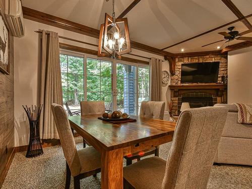 Overall view - 7-102 Ch. Des Quatre-Sommets, Mont-Tremblant, QC - Indoor Photo Showing Dining Room With Fireplace