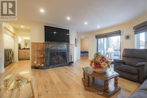 #411 -245 Elgin St W, Cobourg, ON - Indoor Photo Showing Living Room With Fireplace