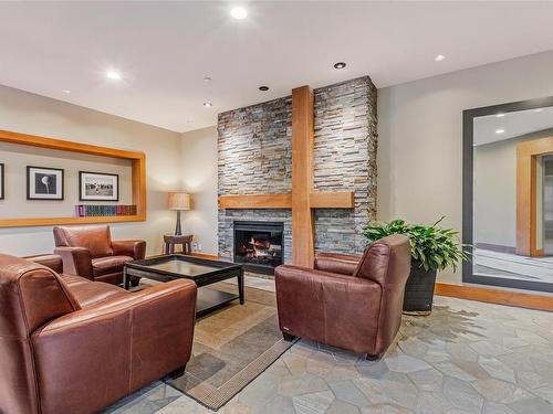 112-1375 Bear Mountain Pkwy, Langford, BC - Indoor Photo Showing Living Room With Fireplace