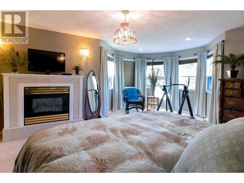 13725 Waldina Road, Prince George, BC - Indoor Photo Showing Bedroom With Fireplace