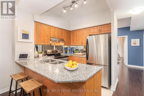 #104 -207 Wellesley St E, Toronto, ON - Indoor Photo Showing Kitchen With Double Sink