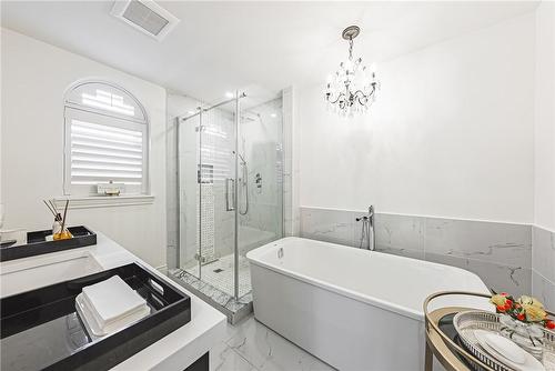 Separate step in soaker tub, glass shower and heated floors - 2220 Lakeshore Road|Unit #11, Burlington, ON - Indoor Photo Showing Bathroom