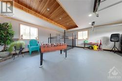 Garage interior with a built in dog pen and access to backyard - 