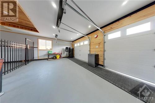 2 car garage interior - 824 Russett Drive, Arnprior, ON - Indoor Photo Showing Garage