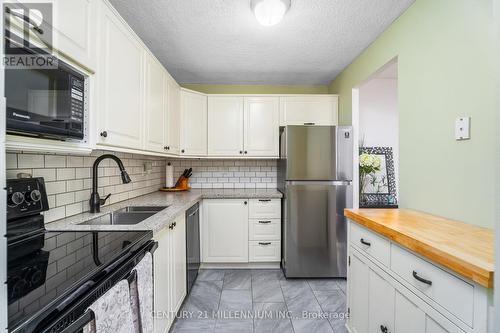 907 - 1100 Caven Street, Mississauga, ON - Indoor Photo Showing Kitchen With Stainless Steel Kitchen With Double Sink