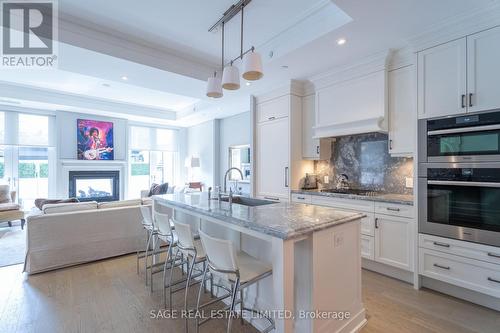 304 - 133 Hazelton Avenue, Toronto, ON - Indoor Photo Showing Kitchen With Fireplace With Upgraded Kitchen