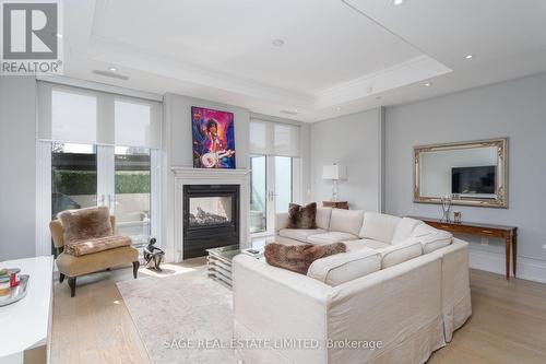 304 - 133 Hazelton Avenue, Toronto, ON - Indoor Photo Showing Living Room With Fireplace