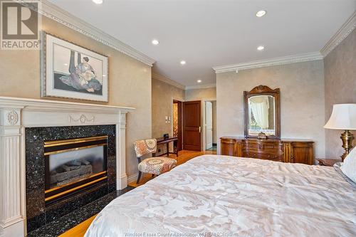 944 Lake Trail Drive, Windsor, ON - Indoor Photo Showing Bedroom With Fireplace