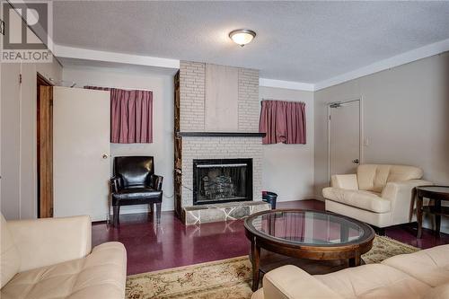 1 Whittaker, Sudbury, ON - Indoor Photo Showing Living Room With Fireplace