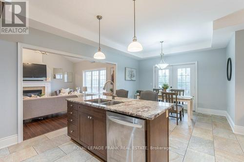 19 Jean Davey Road, Hamilton Township, ON - Indoor Photo Showing Kitchen With Fireplace With Double Sink