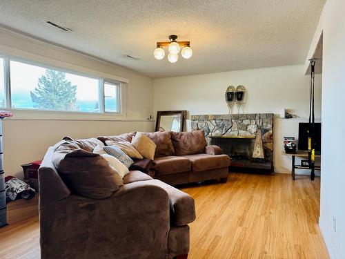 201 14Th Street S, Cranbrook, BC - Indoor Photo Showing Living Room With Fireplace