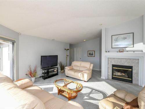 501 Arbutus Bay Rd, Fanny Bay, BC - Indoor Photo Showing Living Room With Fireplace