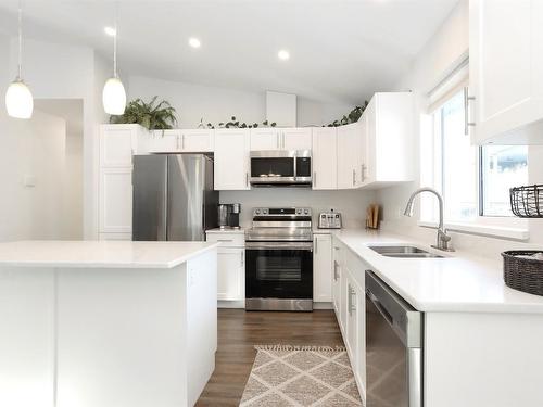 7105 Dunwaters Road, Kelowna, BC - Indoor Photo Showing Kitchen With Stainless Steel Kitchen With Double Sink With Upgraded Kitchen