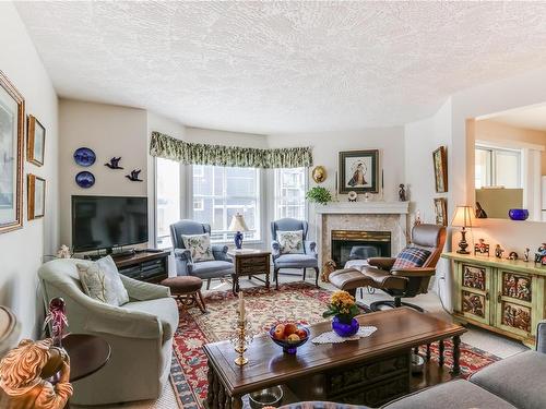 306-220 Island Hwy West, Parksville, BC - Indoor Photo Showing Living Room With Fireplace