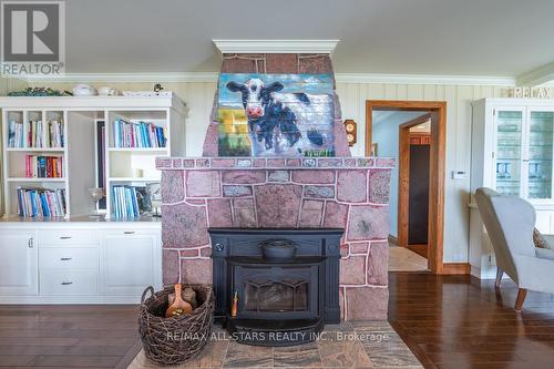 8 Manor Rd, Kawartha Lakes, ON - Indoor Photo Showing Living Room With Fireplace