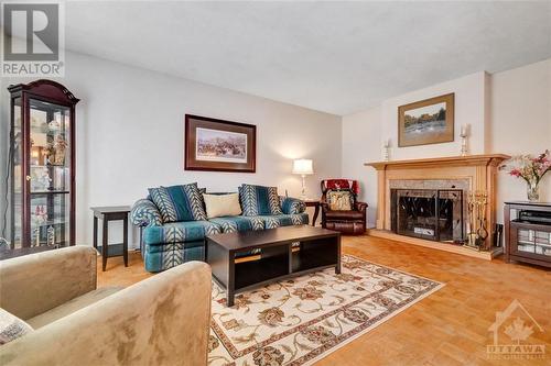 23 Banting Crescent, Ottawa, ON - Indoor Photo Showing Living Room With Fireplace