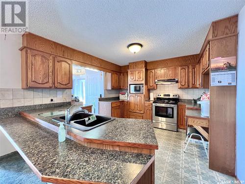8 Maple Place, Outlook, SK - Indoor Photo Showing Kitchen With Double Sink