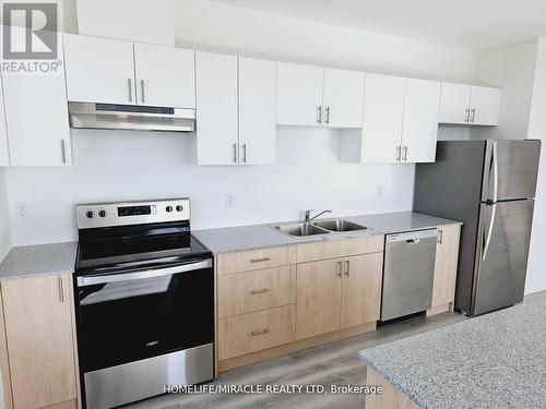 812 - 1098 Paisley Road, Guelph (Parkwood Gardens), ON - Indoor Photo Showing Kitchen With Stainless Steel Kitchen With Double Sink