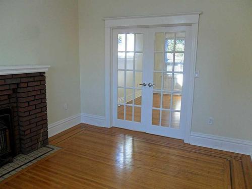 39 Connaught Avenue N, Hamilton, ON - Indoor Photo Showing Other Room With Fireplace