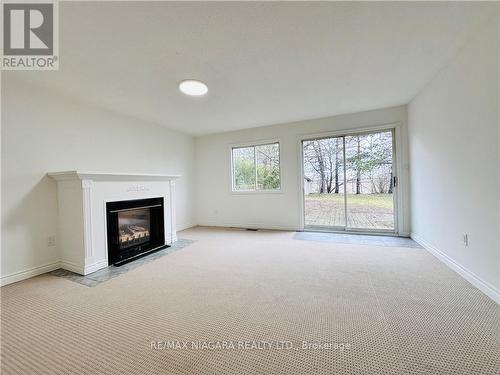 27 Tremont Drive, St. Catharines, ON - Indoor Photo Showing Living Room With Fireplace