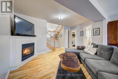 74 Dulgaren Street, Hamilton, ON - Indoor Photo Showing Living Room With Fireplace