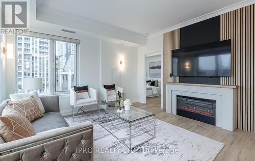 #412 -385 Prince Of Wales Dr, Mississauga, ON - Indoor Photo Showing Living Room With Fireplace
