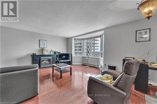 #603 -500 Talbot St, London, ON - Indoor Photo Showing Living Room With Fireplace