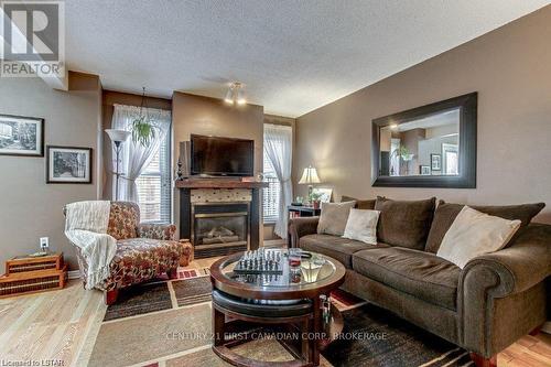 #45 -1199 Hamilton Rd, London, ON - Indoor Photo Showing Living Room With Fireplace