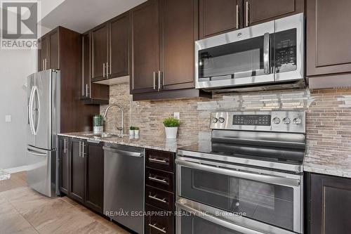 #703 -5001 Corporate Dr, Burlington, ON - Indoor Photo Showing Kitchen With Upgraded Kitchen