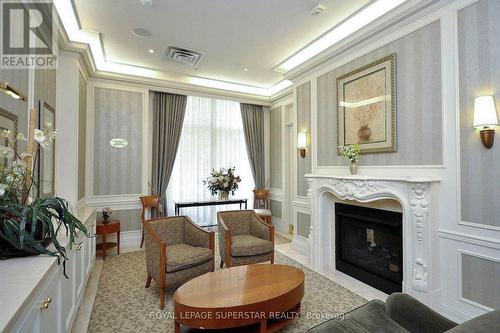 #1120 -25 Kingsbridge Garden Circ, Mississauga, ON - Indoor Photo Showing Living Room With Fireplace