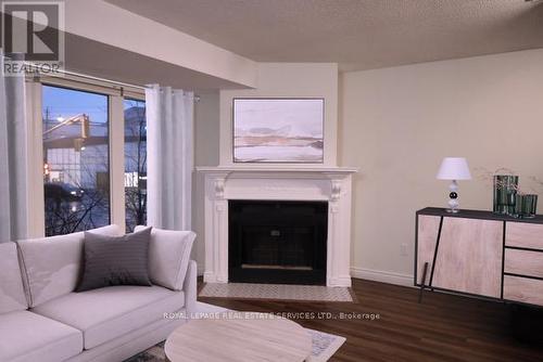 1 - 94 Trinity Street, Toronto, ON - Indoor Photo Showing Living Room With Fireplace