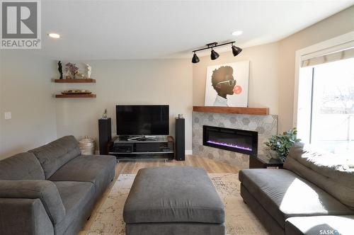 114 Bourgonje Crescent, Saskatoon, SK - Indoor Photo Showing Living Room With Fireplace