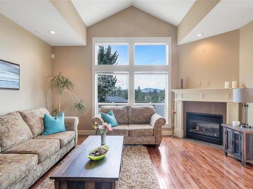 19-551 Bezanton Way, Colwood, BC - Indoor Photo Showing Living Room With Fireplace