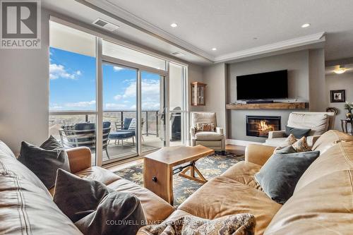 #909 -240 Villagewalk Blvd, London, ON - Indoor Photo Showing Living Room With Fireplace
