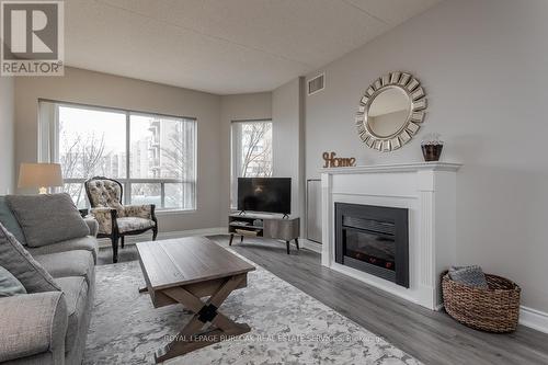 #219 -2075 Amherst Heights Dr, Burlington, ON - Indoor Photo Showing Living Room With Fireplace