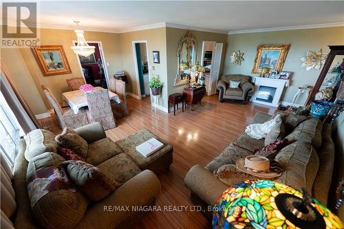 #904 -15 Towering Heights Blvd, St. Catharines, ON - Indoor Photo Showing Living Room With Fireplace