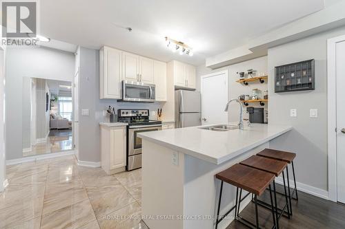#328 -2486 Old Bronte Rd, Oakville, ON - Indoor Photo Showing Kitchen With Stainless Steel Kitchen With Double Sink