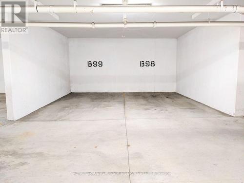 #328 -2486 Old Bronte Rd, Oakville, ON - Indoor Photo Showing Garage
