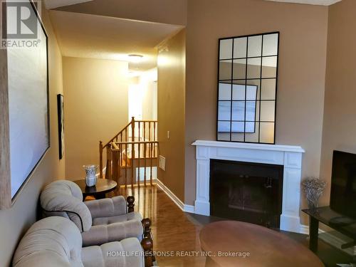 47 Heathcliffe Square N, Brampton, ON - Indoor Photo Showing Living Room With Fireplace
