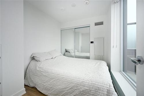 Second Bedroom with Mirrored Closet - 3210 Dakota Common|Unit #A907, Burlington, ON - Indoor Photo Showing Bedroom