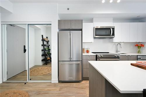 Mirror Closet & Laundry - 3210 Dakota Common|Unit #A907, Burlington, ON - Indoor Photo Showing Kitchen With Stainless Steel Kitchen With Upgraded Kitchen