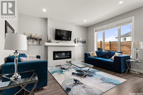 4037 Delhaye Way, Regina, SK - Indoor Photo Showing Living Room With Fireplace